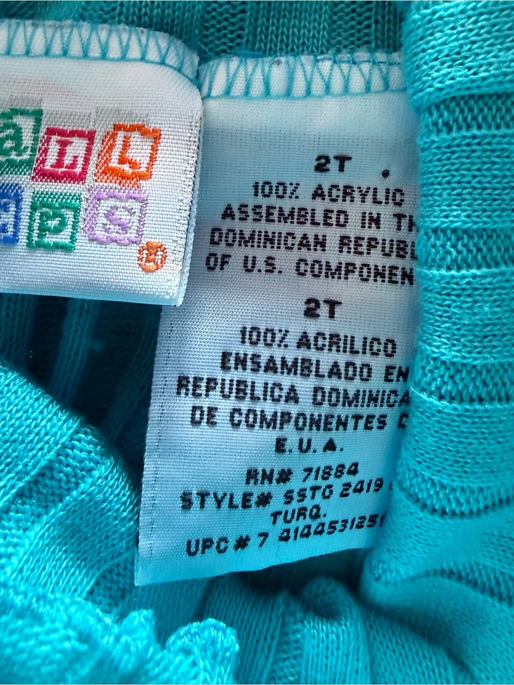 Child’s Turquoise Knit Ruffle-Neck Top with Playful Patchwork Skort/stockings
